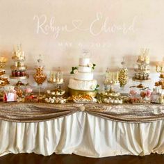 a table topped with lots of cakes and desserts