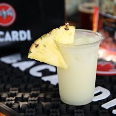 a drink with a slice of pineapple on top