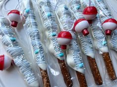 there are many candy sticks wrapped in plastic and decorated with red, white and blue decorations