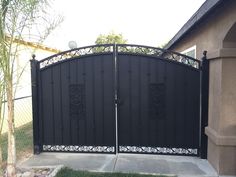 an iron gate in front of a house