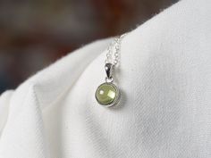 Necklace with natural peridot pendant (silver). The pendant is available alone or with a 925 silver chain, diamond convict link (1.3mm wide): - 38cm (child) - 40cm - 45cm (standard length) - 50cm - 80cm Green Sterling Silver Birthstone Necklace With Round Pendant, Green Sterling Silver Pendant Birthstone Necklace, Green Sterling Silver Birthstone Pendant Necklace, Green Pendant Birthstone Necklace In Sterling Silver, Chain Diamond, Peridot Pendant, Peridot Necklace, Pendant Silver, Pendant Necklaces