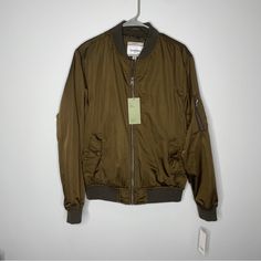 Nwt Goodfellow & Co Olive Bomber Jacket. Size Medium. Previously Purchased For 39.99 Plus Tax. This Jacket Is Water Resistant, Light Weight And Ideal For Layering, And Best If There Is Light Rain. Pockets Are Secured With Snap Button Closure. Zipper Pocket On Sleeve. Smoke Free Home. Please Ask Any Questions Prior To Purchase. Light Rain, Snap Button, Zipper Pocket, Layering, Bomber Jacket, Water Resistant, Jackets & Coats, Man Shop, Size Medium