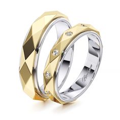 two gold and silver wedding rings with diamonds on each side, set against a white background