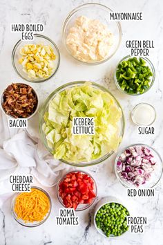 the ingredients for salad laid out in bowls