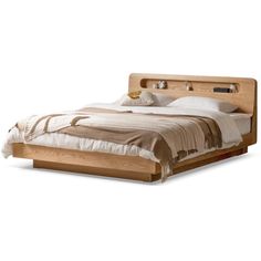 a bed that has been made with wood and white linens on the headboard