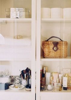 the shelves are filled with cosmetics and toiletries