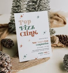 a pop fizz christmas party with pine cones on the side and a card that says pop fizz cink