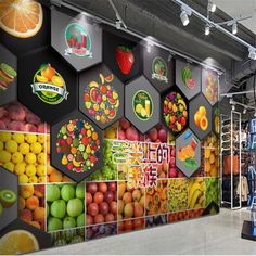 an indoor fruit and vegetable market with large wall graphics