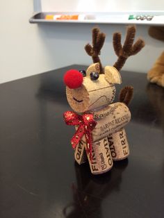 a reindeer made out of wine corks on a table