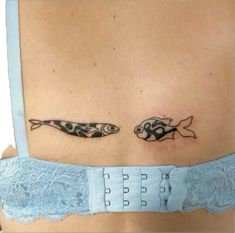 two fish on the back of a woman's stomach