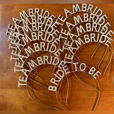 some type of string art on a wooden table with words written in white and black