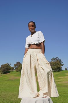 .. A forever wardrobe staple, the Khadijah Pant is a mid-high waisted wide leg pant. With double pleating cascading down the front of each pant leg, this voluminous detail takes on the illusion of a maxi skirt. The smooth waistband on the front fades into an elasticated one on the back. This detail is intended for a comfortable wear, while cinching your waist to ensure the proper fit. Final Sale Imperfect Item - The cream fleece denim pants fit perfectly. Sewn inverted. They have a fleece-like, High Waisted Wide Leg Pants, British Indian, Ethiopia, Workout Pants, Brunei, Caribbean Netherlands, Wardrobe Staples, Wide Leg Pants, Maxi Skirt