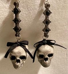 "Pretty little skull drop earrings. A small resin skull with a pretty black bow on a silver and black stone drop, on a silver plated earring hook.  Skulls can be pretty! \"The skull is nature's sculpture\" - David Bailey Once a goth, always a goth..." Cute Gothic Accessories, Goth Silver Jewelry, Goth Earrings Aesthetic, Goth Earrings Diy, Goth Sculpture, Goth Accessories Jewellery, Sculpture David, Goth Jewellery, Skull Earring