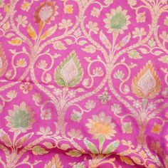 the fabric is pink and green with yellow flowers on it