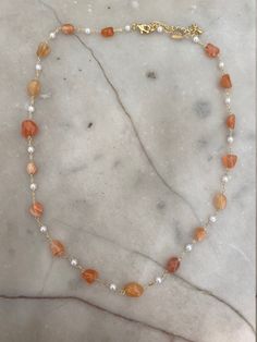 Gold-plated orange agate and pearl beaded necklace. The necklace measures 16 inches with a 2 inch extender. Orange Pearl Necklace As A Gift, Orange Pearl Necklace As Gift, Orange Pearl Necklace For Gifts, Orange Pearl Necklace For Gift, Orange Pearl Necklace, Fall Necklaces, Orange Beaded Necklace, Fall Necklace, Pearl Beaded Necklace