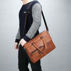 Style: Casual Main Material: Split Leather Exterior: Flap Pocket Closure Type: Zipper Casual Business Faux Leather Shoulder Bag, Casual Business Portable Bag, Casual Business Bags, Modern Portable Brown Bag, Portable Leather Shoulder Bag For Office, Portable Brown Business Satchel, Casual Rectangular Briefcase With Luggage Sleeve, Faux Leather Shoulder Bag For Business In Fall, Trendy Business Shoulder Bag