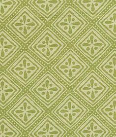 a green and white pattern on fabric