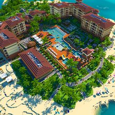 an aerial view of a resort on the beach with many rooms and bathrooms in it