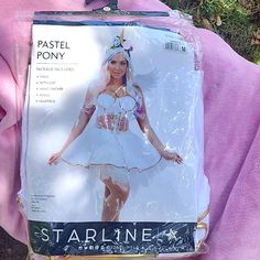 a barbie doll is wearing a white costume