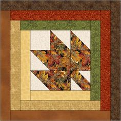 a quilted wall hanging with leaves on the bottom and an arrow in the middle