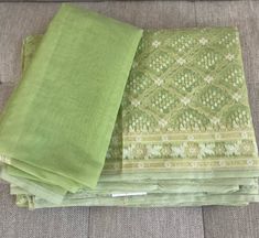 Presenting very pretty green color Banarasi cotton silk with resham jaal Cutwork and Brocade weaving  technique and the jaal motifs made with light gold jari...see the beautiful pallu with tassels. Absolutely gives a lovely feeling 💕 Comes with a blouse piece, however the sarees can be paired with existing any contrast blouse of yoursIf. you have any questions or concerns about the saree, please feel free to contact us and we will be happy to assist you. Green Unstitched Mulmul Suit With Zari Work, Green Unstitched Slub Silk Suit With Chikankari Embroidery, Green Slub Silk Unstitched Suit With Chikankari Embroidery, Green Chanderi Traditional Wear With Chikankari Embroidery, Green Zari Work Mulmul Dupatta, Unstitched Green Chikankari Embroidery Suit In Mulmul, Green Bollywood Unstitched Suit With Chikankari Embroidery, Green Chikankari Embroidery Dupatta For Diwali, Bollywood Style Green Unstitched Suit With Chikankari Embroidery