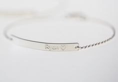 "The Bar Bracelet is made by engraving machine. It is precious work to make the bracelet and I use High-Quality Material and offer it at a affordable price. The personalized bracelet is simple,dainty and perfect for Gift like Birthday gift, Wedding gift and Christmas Gift. 1, Details *High Quality 925 Sterling Silver Bar : 40mm*4mm *All Materials are 925 Sterling Silver. 2, We can engrave * Names and Dates * Coordinates * Roman Numerals * Please indicate in a message to seller that you want the Minimalist Engraved Bracelets For Personalized Gifts, Silver Engraved Heart Bracelet, Adjustable, Engraved Adjustable Chain Bracelet For Personalized Gift, Minimalist Engraved Name Bangle Bracelet, Minimalist Adjustable Bracelet With Engraved Text, Adjustable Engraved Chain Bracelet For Personalized Gift, Adjustable Engraved Name Bracelet In Sterling Silver, Adjustable Sterling Silver Name Bracelet With Engraving, Adjustable Nameplate Bracelets With Engraved Text