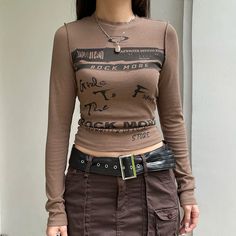 SIZE Length/cm Bust/cm Waist/cm Bottom Width/cm Shoulder/cm Sleeve/cm S 47 75 64 / 33 62 M 48 89 68 / 34 63 L 49 83 72 / 35 64 NOTE: 1. Please strictly follow the size chart to select the size. Do not select directly according to your habits.2. Still not sure about size? We'd love to advise based on your measurements of bust, waist and hip.3.The size may have 2-3cm differs due to manual measurement. Please note when you measure. 90s Harajuku Fashion, 90s Harajuku, Tøp Aesthetic, Baby Tees Y2k, Bodysuit Dress, Y2k Baby Tee, Fall Tee, Aesthetic Shirts, Long Sleeve Tops Casual