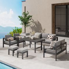 an outdoor patio furniture set near a swimming pool