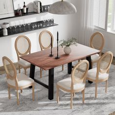 a dining room table with chairs around it