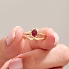 The 14k Solid Gold Red Gemstone Ring is stunning handmade jewelry, perfect for engagements or special occasions. Featuring a vibrant red tourmaline, this bezel-set birthstone solitaire ring is designed for women who appreciate unique and elegant jewelry. Crafted in 14k solid gold, it's a timeless accessory that adds a touch of sophistication to any outfit. Ring Details   ❥ Gold KT: 14k Solid Gold (also in 10, 18K)  ❥ Gold Color Options: White, Yellow, Rose Gold  ❥ Top Width: 8.00x6.20 mm  ❥ Top Formal Ruby Stackable Rings, Oval Ruby Ring Stackable For Formal Occasions, Classic Oval Ruby Ring Stackable, Oval Ruby Stackable Ring For Anniversary, Oval Stackable Ruby Ring For Anniversary, Classic Oval Stackable Ruby Ring, Anniversary Oval Ruby Stackable Ring, Anniversary Stackable Oval Ruby Ring, Oval Solitaire Ruby Ring