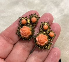 "These stunning carved coral celluloid earrings take my breath away! I love the paisley shape of the brass screw-back setting and all of the delicate intricacies that bring the stones to life.  They have a beautiful patina and measure 1 1/8\" long by 3/4\" wide at the widest point. Would make a great gift or something special to add to your jewelry wardrobe." Vintage Orange Pierced Earrings, Vintage Orange Jewelry With Matching Earrings, Vintage Orange Nickel-free Earrings, Vintage Coral Jewelry For Wedding, Coral Vintage Jewelry For Wedding, Vintage Filigree Clip-on Earrings, Vintage Orange Earrings, Jewelry Wardrobe, Take My Breath