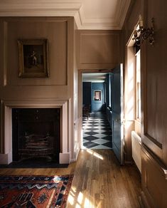 an empty hallway leading to a living room