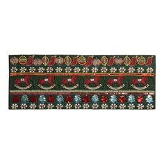 a green and red christmas ribbon with ornaments on it