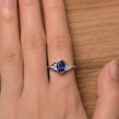 It is a lab sapphire ring. The main stone is 6 mm*8 mm oval cut.weight about 1.75 carats. The basic metal is sterling silver and plated with rhodium. To change the metal to a solid gold (white/rose) or platinum is also available, please ask for a quotation if you want. You can also go to my shop Home for more elegant rings: https://www.etsy.com/shop/godjewelry?ref=hdr_shop_menu Sapphire is the September birthstone. More sapphire rings: https://www.etsy.com/shop/godjewelry?section_id=20715031 Cus Classic Sapphire Oval Cabochon Ring, Classic Sapphire Oval Rings, Classic Cubic Zirconia Birthstone Ring, Sterling Silver Oval Birthstone Promise Ring, Classic Oval Cabochon Sapphire Ring For Anniversary, Classic Sapphire Oval Cabochon Jewelry, Classic Oval Sapphire Ring In 14k White Gold, Classic Oval Jewelry For Promise, Oval Blue Birthstone Ring For Anniversary