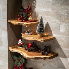 three wooden shelves with christmas decorations on them