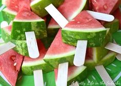 slices of watermelon and popsicles with toothpicks