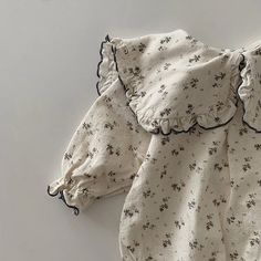 🌸 Elevate your little one's style with our Floral Print Romper with Headband! 🌼 Perfect for 0-24 months, this adorable romper is made from comfy cotton, ideal for spring and autumn adventures. 🍂 Designed for baby girls, it features a charming floral pattern, a turn-down collar, and a covered button closure. With full sleeves and a perfect fit, your baby will bloom in cuteness! 🌟 Don't miss out on this delightful romper—a must-have in every baby's wardrobe. Shop now and dress your baby girl i Spring Long Sleeve Bubble Romper For Playtime, Cute Cotton Jumpsuits And Rompers With Long Sleeves, Spring Playtime Long Sleeve Bubble Romper, Cute Cotton Jumpsuit With Long Sleeves, Cotton Jumpsuits And Rompers With Ruffles, Spring Playtime Bubble Romper With Long Sleeves, Cotton Long Sleeve Bubble Romper For Playtime, Cute Long Sleeve Bubble Romper For Spring, Cute Cotton Onesie For Spring