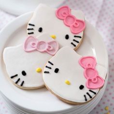 hello kitty cookies are sitting on a plate