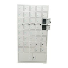 a white wall mounted mailbox with multiple compartments and doors on each side, in front of a white background