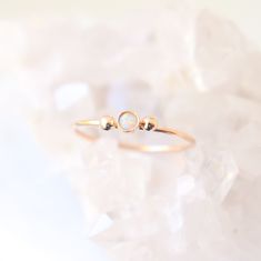 A solid 14k gold little beauty. Our dainty little gold diamond ring is accompanied by two solid 14k gold dew drops. Perfectly understated, feminine and sweet. Personalize your slim gold ring by selecting a stone to represent a birthday, as an engagement ring or just because (see last photo)! {DETAILS}: * select a natural diamond or lab grown 3mm cz diamond / birthstone (all conflict free!) * solid 14k gold bezel cup and band * solid 14k gold drops (on either side of the gemstone) * 1mm solid 14k 14k Gold Filled Stackable Wedding Rings, 14k Gold Filled Dainty Promise Ring, Delicate 14k Gold Filled Stackable Promise Rings, 14k Gold Filled Stackable Rings For Promise, 14k Gold Filled Stackable Rings As Promise Ring, Dainty Stackable Promise Jewelry, Fine Jewelry 14k Gold Filled Stackable Promise Rings, Dainty Stackable Jewelry For Promise, Dainty 14k Gold Filled Promise Ring