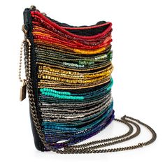 A stunning array of rainbow bead strands adorn the front of this crossbody handbag for a colorful and vibrant look that not only adds a playful movement to your style, but also exudes a passionate and energetic vibe. 10 x 1 x 7" Strap Length End to End: 49" Strap Drop: 23" Removable crossbody chain strap Zipper closure Inside pocket Back pocket Contains leather Fits a phone Includes: metal logo fob, protective storage bag, certificate of authenticity This is a handmade item, each one an individu Leather Fits, Big Handbags, Mary Frances, Diy Weaving, Best Handbags, Handmade Purses, Top Handle Handbags, Rainbow Beads, Leather Handbags Crossbody