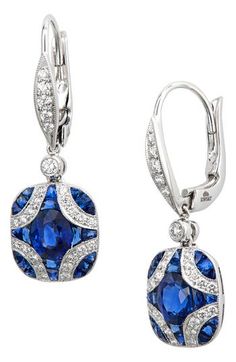 These 18-karat gold earrings deliver vintage-inspired style with an elegant argyle pattern in blue sapphires and fiery diamonds. 1" drop; 1/2" width Lever-back closure Total diamond weight: 0.35ct. Total sapphire weight: 0.38ct. Color: G-H Clarity: VS1-VS2 18k gold/sapphire/diamond Made in the USA >Diamond Guide Luxury Oval Sapphire Diamond Earrings, Luxury Sapphire Diamond Earrings, Luxury Blue Diamond Earrings With Brilliant Cut, Luxury Sapphire Earrings, Luxury Oval Sapphire Earrings, Luxury Blue Diamond Earrings With Accents, Luxury Blue Diamond Earrings, Luxury Sapphire Diamond Earrings With Brilliant Cut, Luxury Blue Diamond Drop Earrings