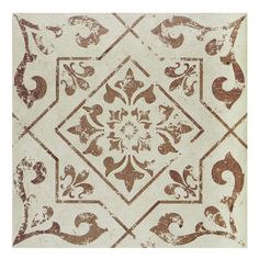 a white and brown tile with an ornate design