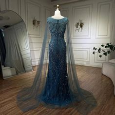 a dress on display in front of a mirror