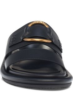 Designer Leather Slip-on Slides, Modern Slide Mules With Buckle Closure, Formal Leather Slides, Modern Formal Slide Mules, Modern Black Slides With Buckle Closure, Formal Leather Footbed Slides, Formal Slides With Leather Footbed, Classic Leather Slides With Single Toe Strap, Elegant Leather Slides With Buckle Closure