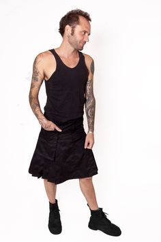 "Mens pleated skirt Kilt inspired Black cotton twill 7 topstitched pleats on each side Fly and button closure 5 belt loops Large removable pocket : Buttons for side fixing Large belt loop on the pocket S : waist 84 cm / 33\", lenght 53 cm / 20¾\" M : waist 91 cm / 35¾\", lenght 55 cm / 21¼ \" L : waist 98 cm / 38½\", lenght 57 cm / 22 ½\" XL : waist 104 cm / 41\", lenght 59 cm / 23¼\" 2XL : waist 112 cm / 44\", lenght 61 cm / 24\"" Fitted Punk Skirt With Pockets, Cotton Summer Skirt With Cargo Pockets, Summer Cotton Skirt With Cargo Pockets, Fitted Skirt With Pockets For Alternative Fashion, Punk Style Cotton Pleated Skirt, Cotton Skirt With Belt Loops, Fitted Cotton Cargo Skirt With Multiple Pockets, Fitted Cotton Cargo Skirt With Pockets, Cotton Accordion Pleated Skirt