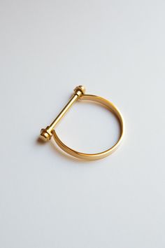 "Minimalist Gold Screw Bar Cuff Bracelet, Gold Bar Bracelet, Gold Screw Cuff Bracelet ✦  Gold Plating over Stainless Steel  ✦  Measure around your wrist and add 1 cm for snug fit and 2 cm for looser fit ✦  Small (Inner Diameter): 2.25\" x 2\", 6.75\" inner circumference (wrist) ✦  Medium (Inner Diameter): 2.5\" x 2.12\", 7.48\" inner circumference (wrist) ✦  High Polish Finish and Sturdy Design ✦  Silver Version: https://www.etsy.com/listing/600918864/minimalist-silver-screw-bar-cuff ✦  Rose Gold Version: https://www.etsy.com/listing/614756975/minimalist-rose-gold-screw-bar-cuff Gold Shackle Bracelet, Gold Horseshoe Bracelet, U shaped Bracelet, U-Shaped, D Bar Bracelet, Gold Stacking Bracelet, Equestrian Bracelet, Gold Bangle, Gold Bracelet, Cuff Bracelet, Minimalist Bangle, Minimalist Bra Equestrian Bracelet, Horseshoe Bracelet, Minimalist Bangle, Cuff Bracelet Gold, Gold Bar Bracelet, Bar Bracelet, Gold Bracelet Cuff, Minimalist Bracelet, Bar Bracelets