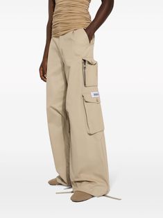 Find DOLCE & GABBANA Wide-leg Cargo Pants on Editorialist. beige cotton gabardine weave appliqué logo belt loops concealed fly and button fastening multiple cargo pockets wide leg drawstring cuffs Beige Cotton Utility Work Pants, Beige Utility Parachute Pants With Belt Loops, Beige Patch Pockets Pants For Streetwear, Beige Straight Leg Parachute Pants With Belt Loops, Beige Wide Leg Cargo Pants With Belt Loops, Beige Pants With Belt Loops For Streetwear, Beige Bottoms With Belt Loops For Streetwear, Beige Streetwear Pants With Patch Pockets, Beige Streetwear Pants With Belt Loops