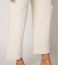 The Taylor Trouser is the perfect cropped twill pant for your day-to-day wardrobe. In a dreamy ivory color, it features a unique patch pocket detail at the knee and functional pockets at the hip. Designed to pair back to all Cleobella tops, sweaters, and blouses, see below for some styling inspo! Made of 100% organic cotton twill Ethically Handmade in India If between sizes, size down Mid-rise Side welt pockets Princess seams Functional patch pocket at knee Double belt loops at front and back No Cream Utility Cargo Pants For Spring, Cream Cargo Pants For Workwear, Cream Cargo Pants With Pockets For Workwear, Cream Workwear Pants With Side Pockets, Fall Cream Cargo Pants With Pockets, Cream Cargo Pants With Side Pockets For Spring, Workwear Cream Bottoms With Side Pockets, Cream Straight Leg Cargo Pants With Patch Pockets, Spring Beige Cargo Pants With Patch Pockets