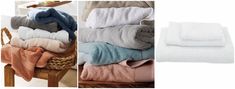 towels stacked on top of each other in different colors and sizes, next to a basket full of folded towels